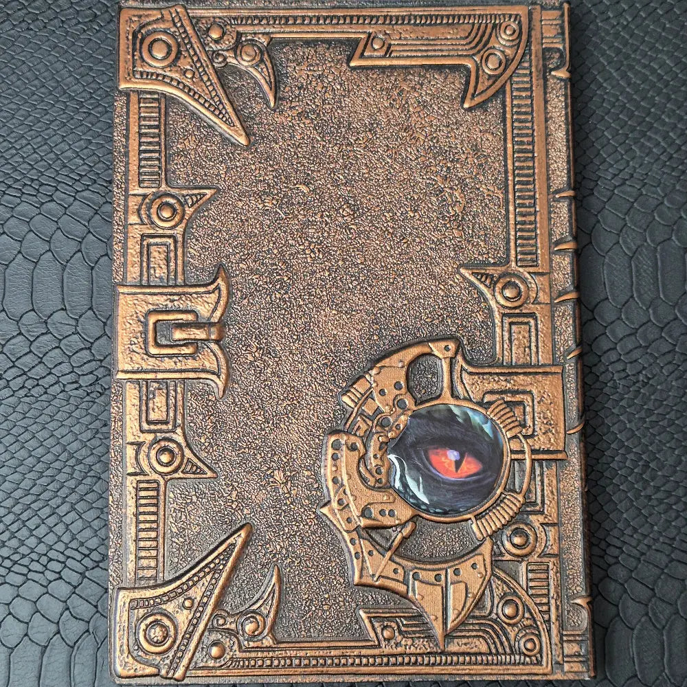 A bronze coloured notebook/journal for DND and other TTRPG games