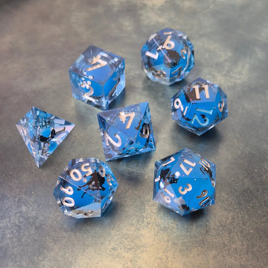 Blue sharp edge resin dice set with liquid core and black cat stickers on metal plate