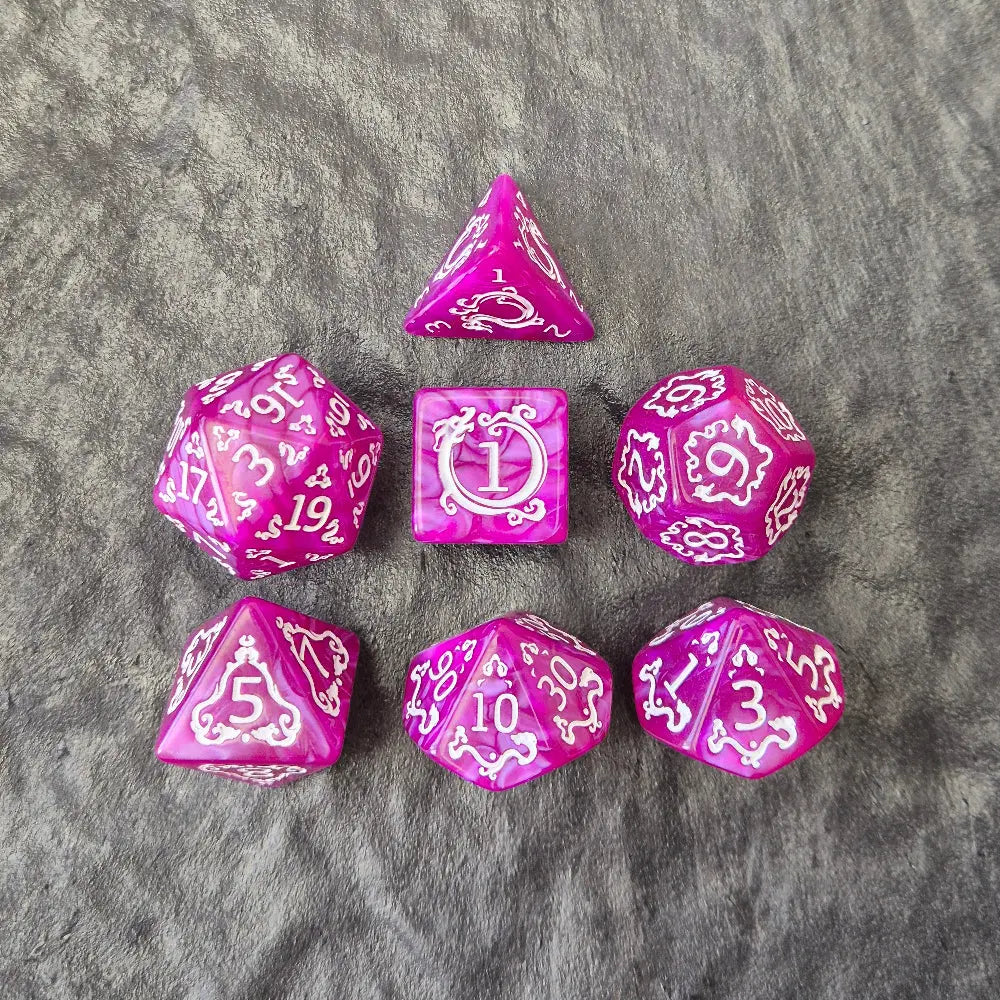Purple acrylic polyhedral dice set with white ornate numbering, styled with arcane fantasy motifs, displayed on a stone surface.