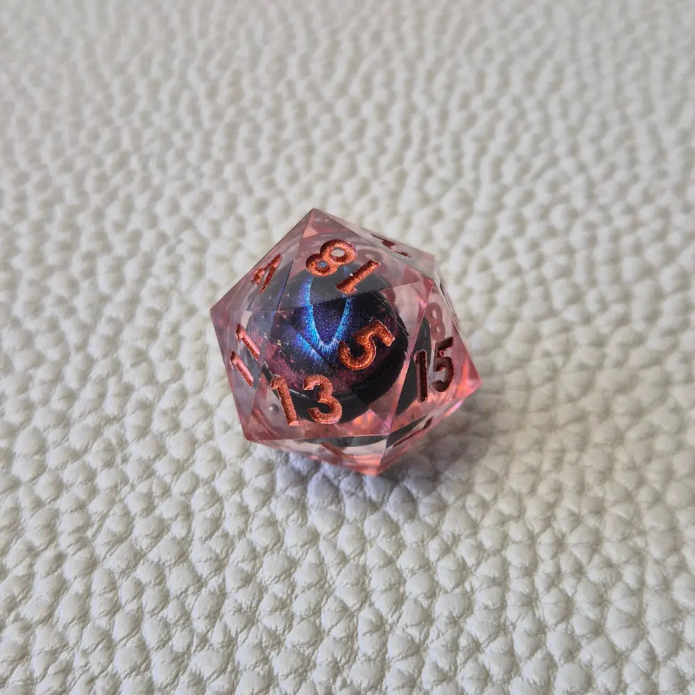 A set of red tinted clear liquid core dice with a moving dragon eye inside on a white textured background
