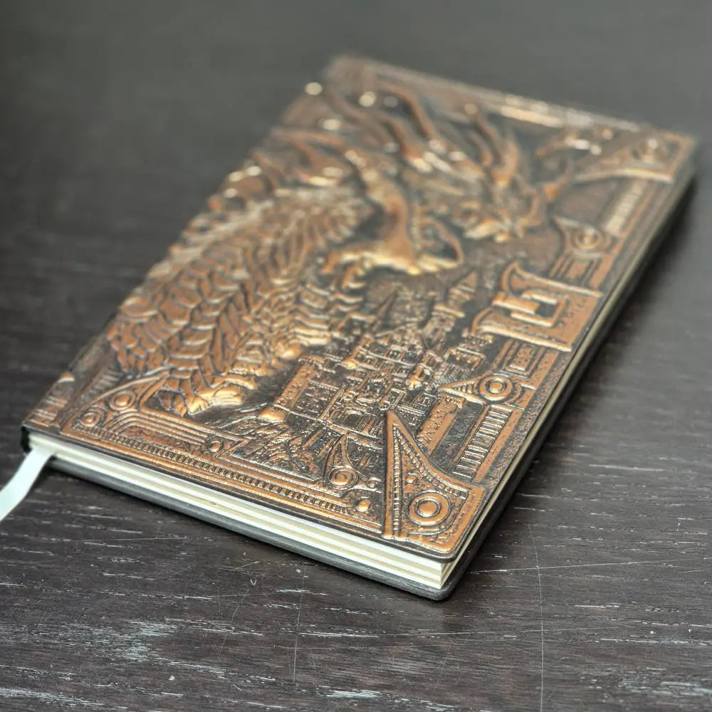 A bronze coloured notebook/journal for DND and other TTRPG games