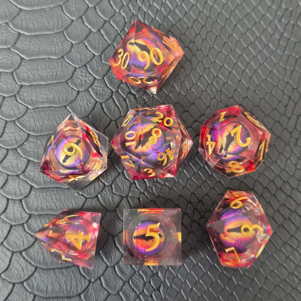 A set of clear red tinted liquid core resin dice with a moving dragon eye inside, displayed on a black textured surface