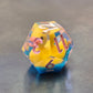 Whimsical sharp-edge D12 with floating yellow ducks and pink numbering, set in clear resin over a blue water-like base.