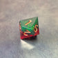 A set of Green and red sharp edge dice filled with sparkles and gold numbers.