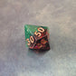 A set of Green and red sharp edge dice filled with sparkles and gold numbers.
