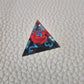 A set of clear sharp-edge resin dice with black ground color and red rose inside.