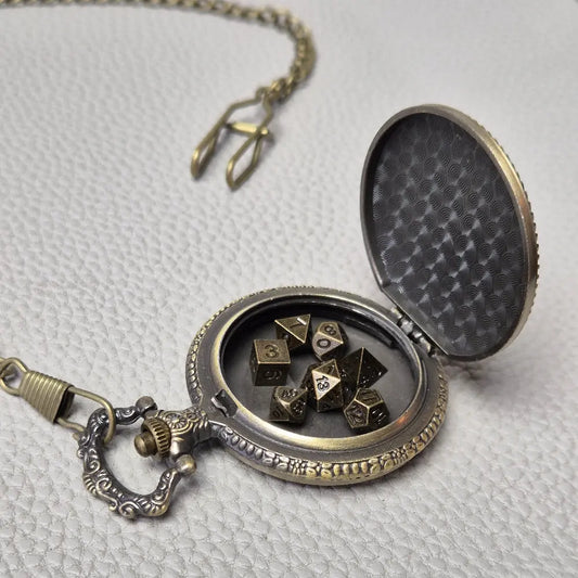 A Bronze coloured full metal pocket watch themed dice locket, with engraved backside and detailed dragon on the front. Contains full set of metal dice inside