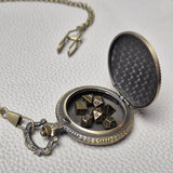 A Bronze coloured full metal pocket watch themed dice locket, with engraved backside and detailed dragon on the front. Contains full set of metal dice inside