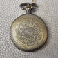 A Bronze coloured full metal pocket watch themed dice locket, with engraved backside and detailed dragon on the front. Contains full set of metal dice inside
