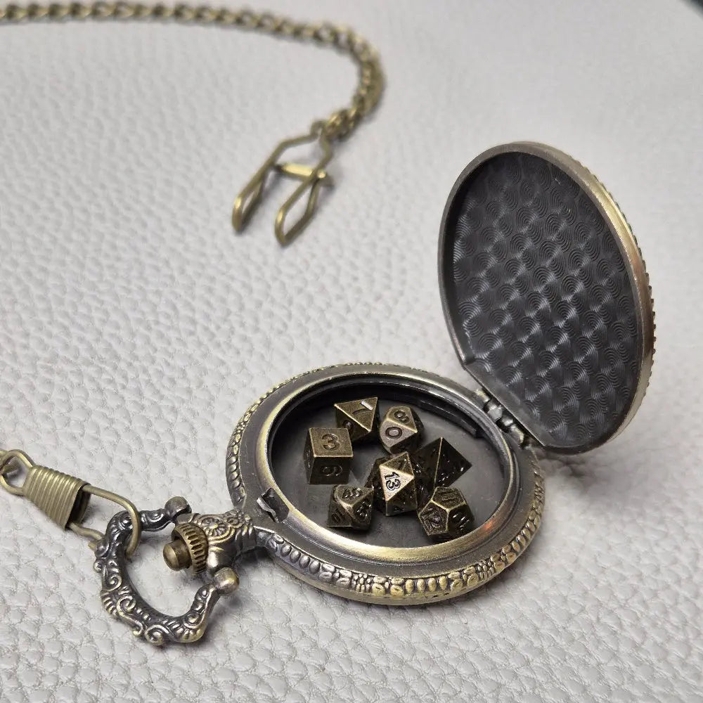 A Bronze coloured full metal pocket watch themed dice locket, with engraved backside and detailed kraken on the front. Contains full set of metal dice inside