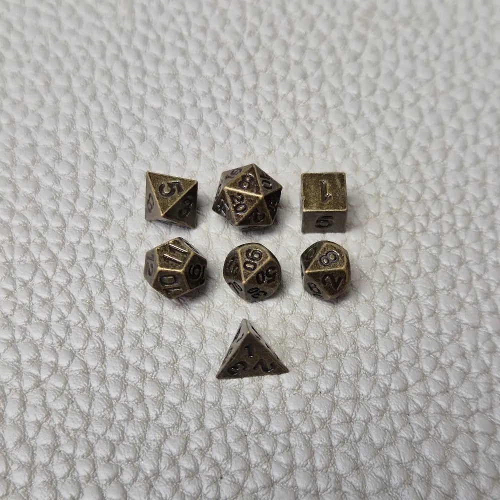 A Bronze coloured full metal pocket watch themed dice locket, with engraved backside and detailed kraken on the front. Contains full set of metal dice inside