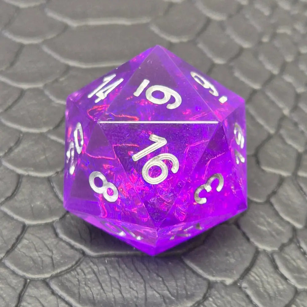 A D20 sharp-edge purple resin dice and silver numbering, displayed on a black scale-textured surface.