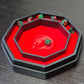 Octagonal red dice tray with dragon emblem and black leather edge, shown open.