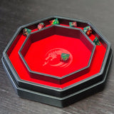 Octagonal red dice tray with dragon emblem and black leather edge, shown open.