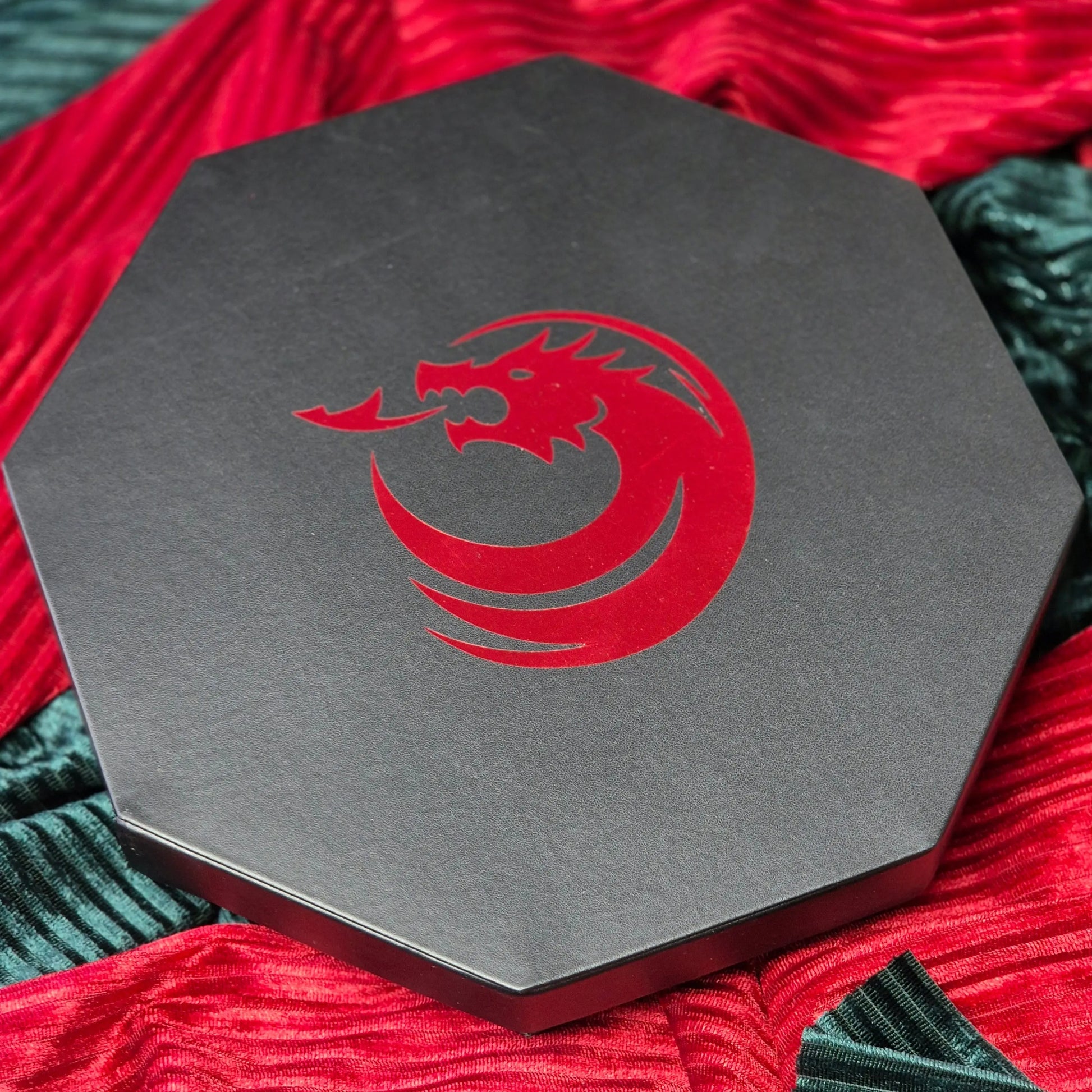 Octagonal red dice tray with dragon emblem and black leather edge