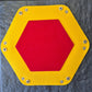Foldable hexagon-shaped dice tray in yellow & red.
