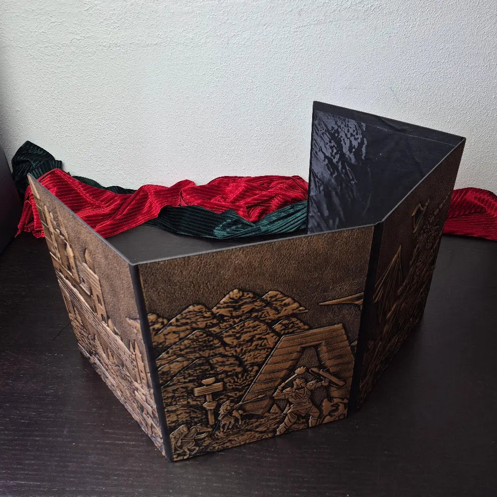 Foldable four-panel Dungeon Master screen with embossed fantasy scenes, displayed on a dark tabletop.